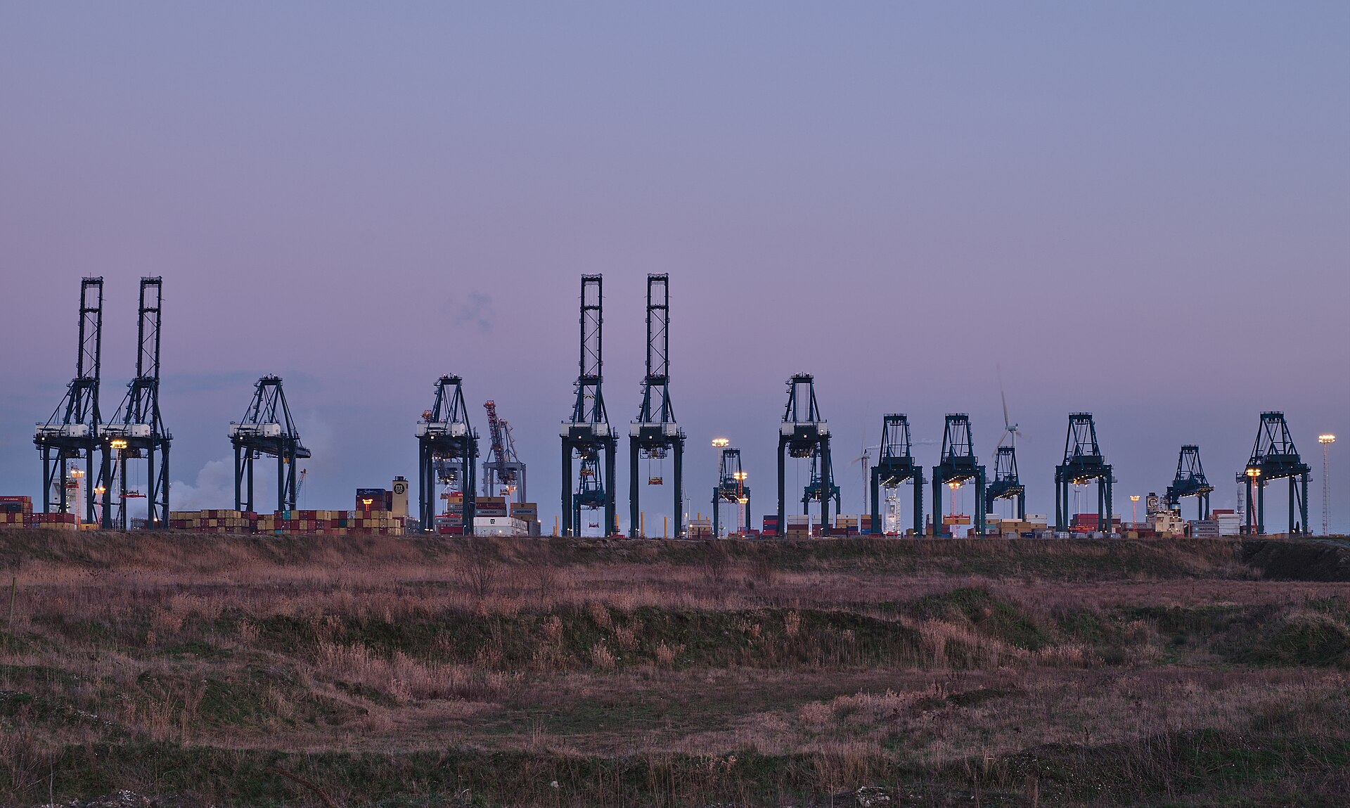 Container cranes at a port at twilight